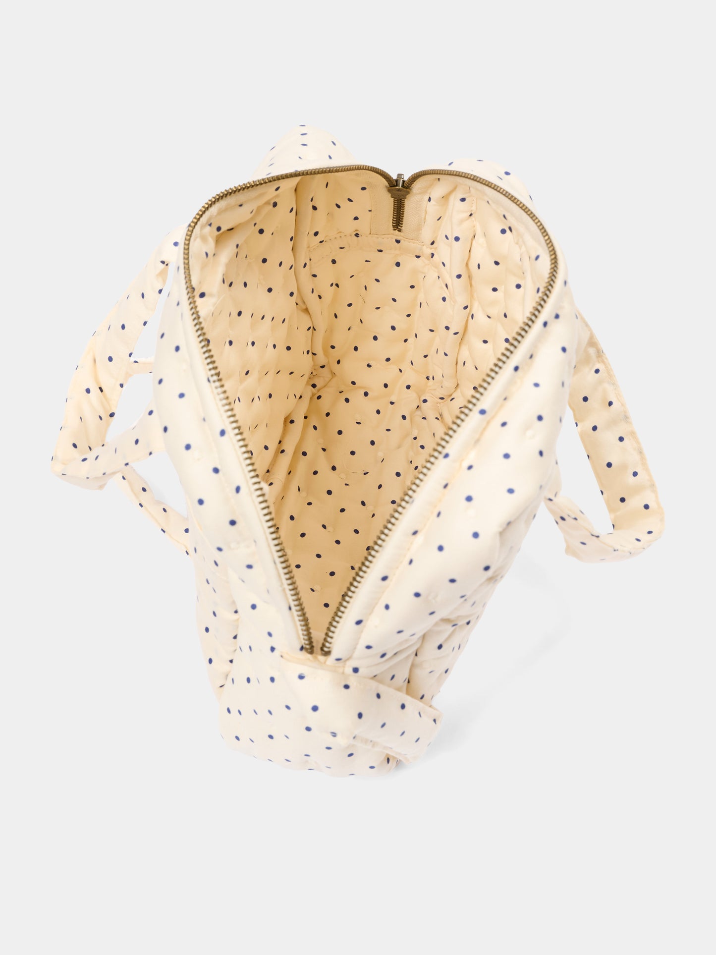 Ivory sensory play bag for girl with polka dots