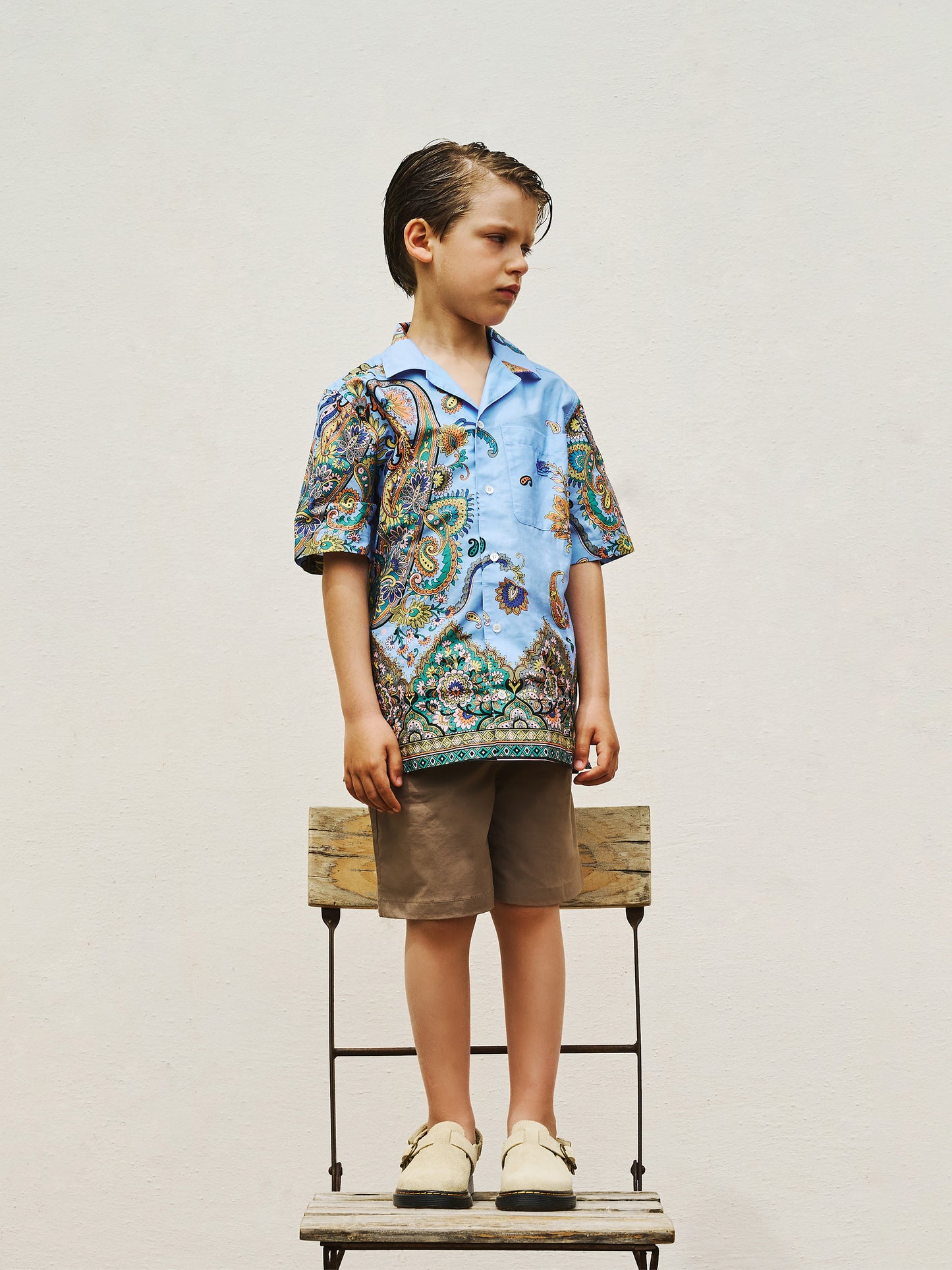 Light blue shorts for boy with paisley pattern