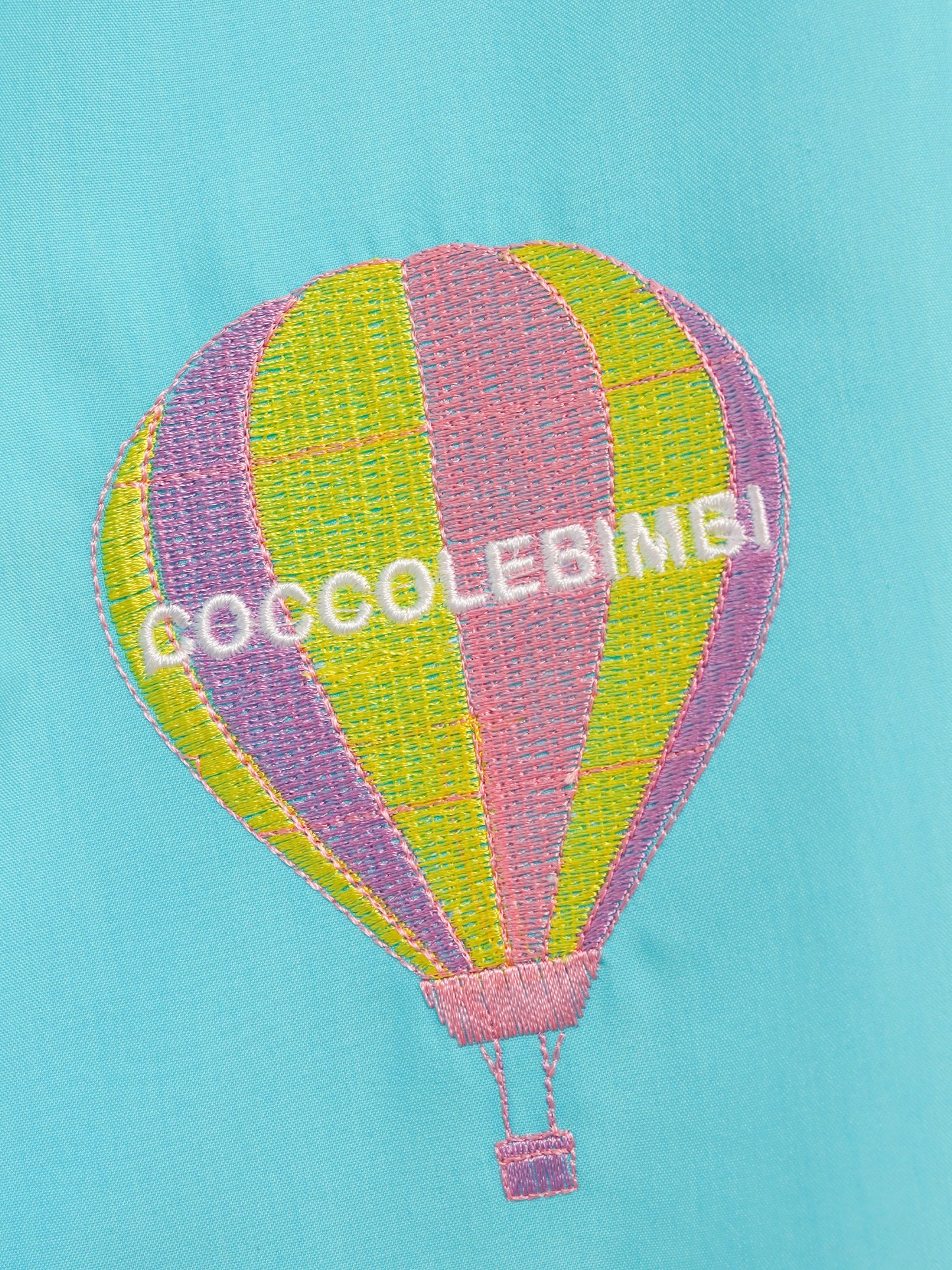 Light blue dress for girl with clouds and hot air balloon