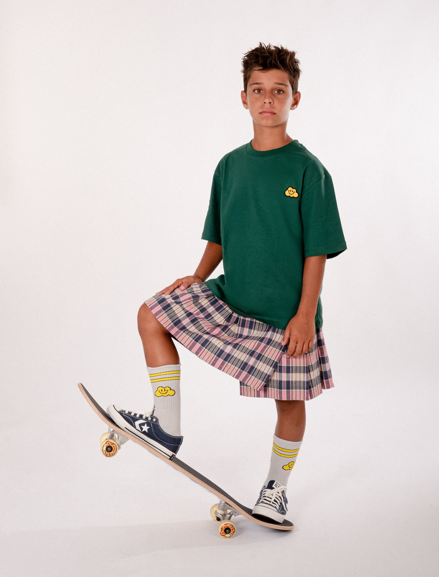 Green t-shirt for kids with yellow clouds